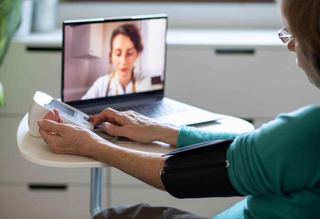 an old women taking her telemedicine service