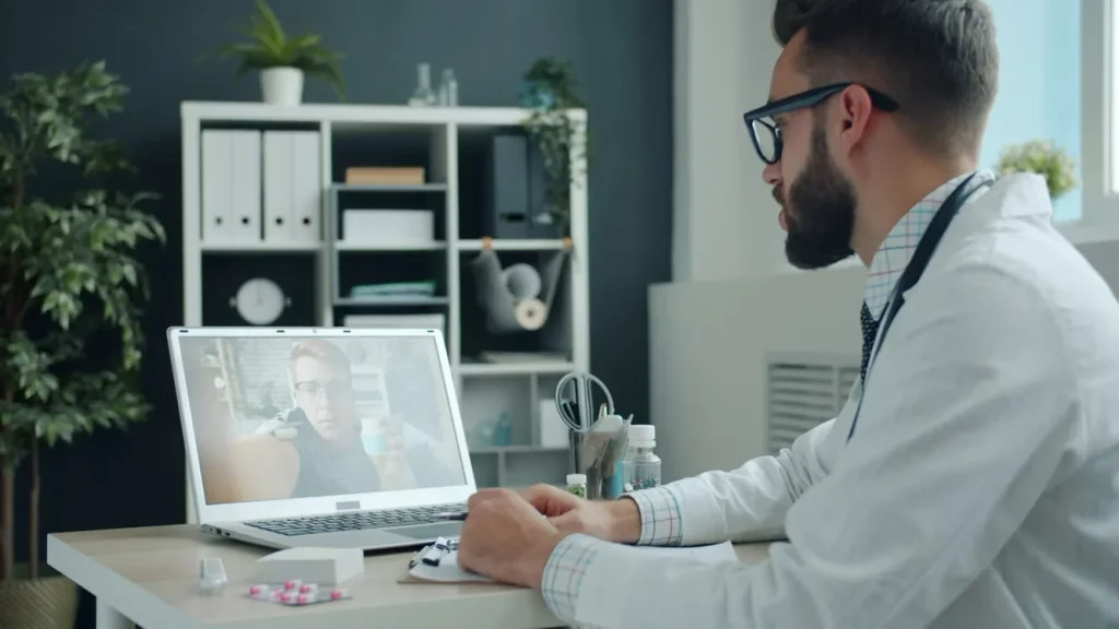 Healthcare provider talking with a patient during a telehealth video visit about GLP-1 treatment options